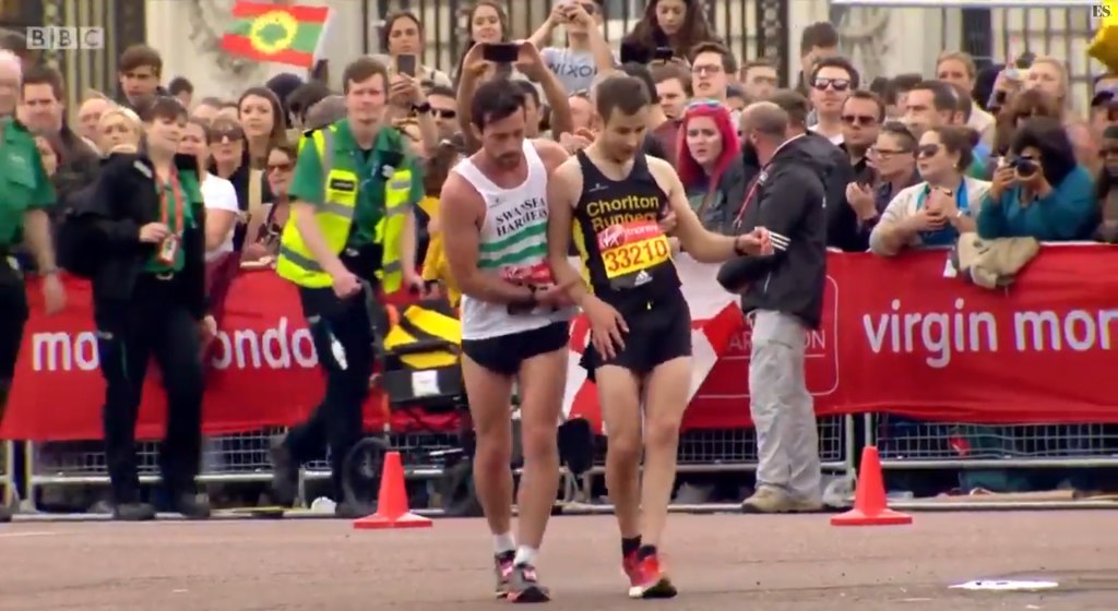 Marathoner Helps Collapsed Runner Across Finishing Line - Latest ...